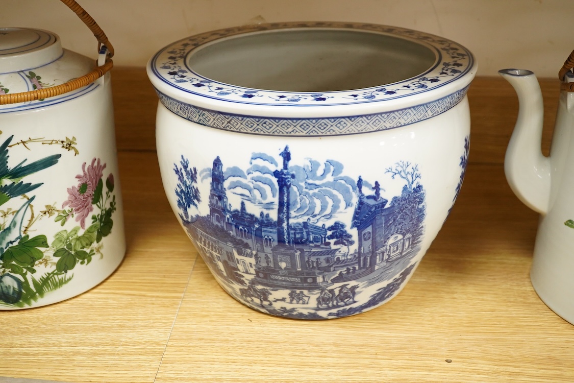 A pair of Chinese large scale teapots and a European blue and white planter, 22.5cm